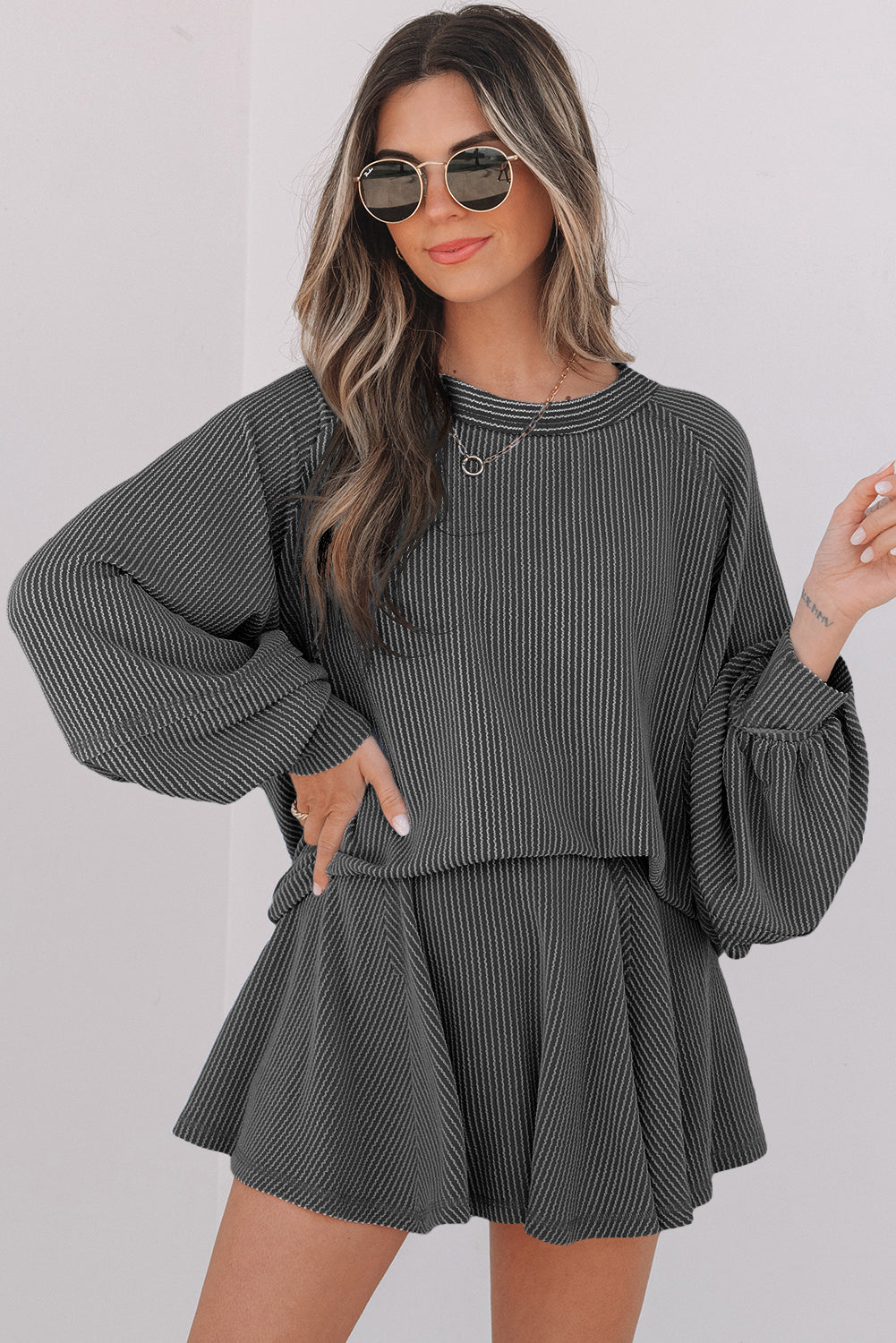 Casual blue 2-piece set featuring a loose top and drawstring skirt with pink accents, perfect for stylish comfort.